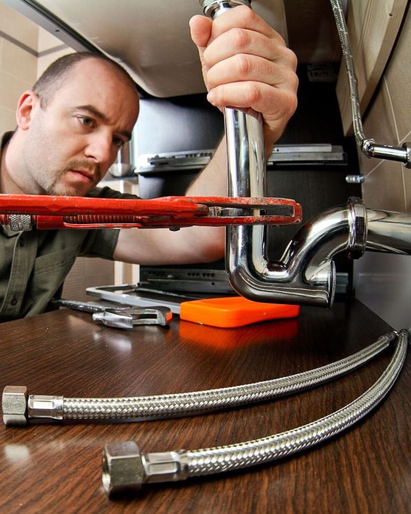 portrait of caucasian plumber at work